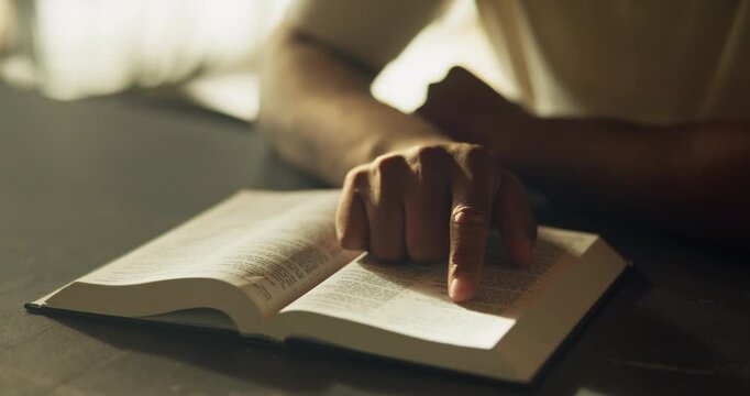 Hands, christian and person reading with bible, guidance and verse for spiritual understanding. Holy, book and pointing for learning scripture, religious education and sermon preparation with faith