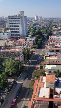 Aerial view of the Vedado neighborhood with historic buildings, streets, and vintage cars in Havana, Havana, Cuba.