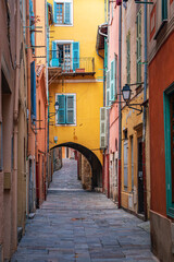 Obraz premium Traditional old terracotta houses on a narrow street in the Old Town of Villefranche sur Mer on the French Riviera, South of France