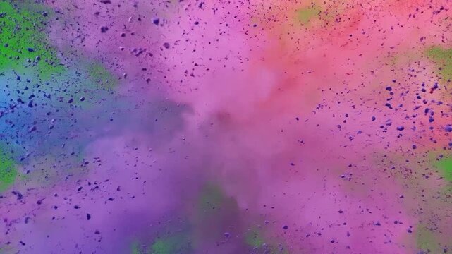 Vibrant explosion of colorful powder on a green screen background