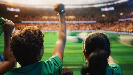 Close-up of excited football supporters in stadium stands pumping fists, doing match celebration for football fan and match day concepts. © DC Studio