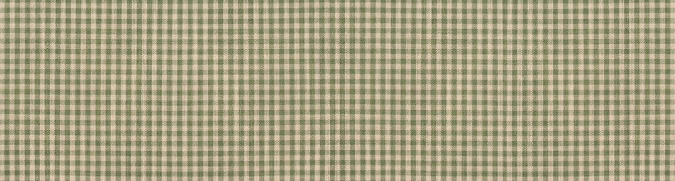 Green and beige checkered gingham fabric texture with a rustic linen weave.