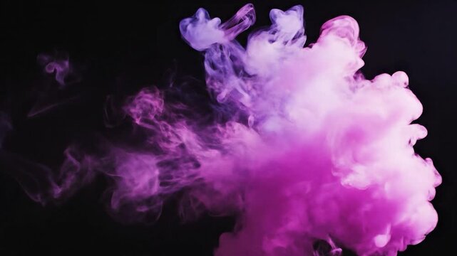 Pink ink cloud swirls in water against a black background