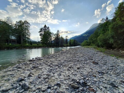 Wide gravel bank along the Lech River at sunset near H&auml;selgehr, Tyrol, Austria