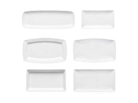 Six distinct rectangular white ceramic plates and platters, isolated on a transparent background.