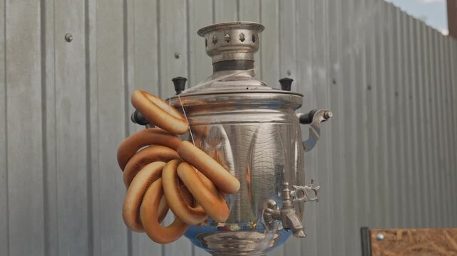 A samovar for making tea. Bagels are hanging on the samovar. Folk traditions of Eastern Europe.