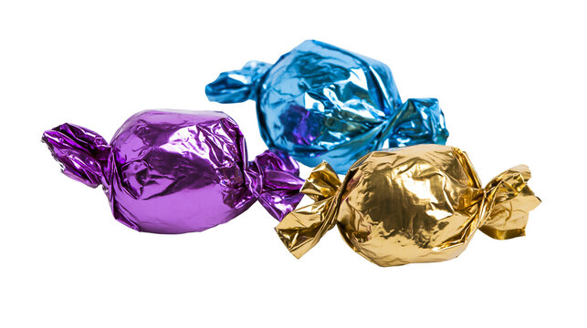 Three colorful foil-wrapped candies purple gold, and blue