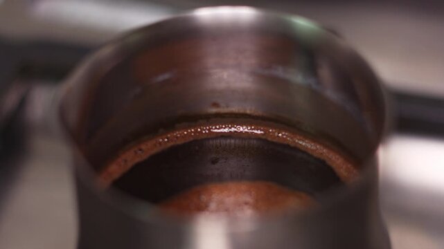 Traditional Turkish Coffee Brewing in a Copper Cezve Pot on a Stove
