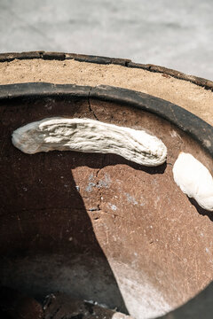 Traditional baking of Georgian Shoti bread in a tone oven