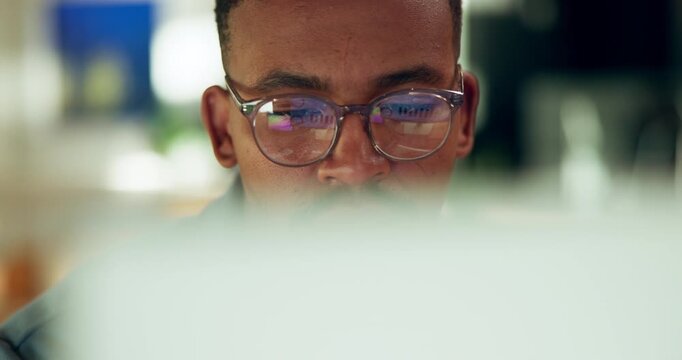 Reading, computer and black man with glasses for online report, seo review and research for website. Night, office and person with tech for planning, project deadline or proposal for digital campaign