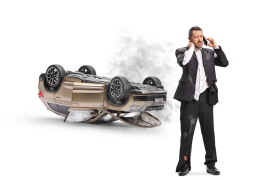 Man making a phonecall after a car accident