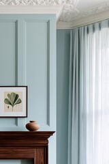 Fototapeta premium Living room corner featuring a dark walnut mantelpiece, light blue wall with decorative paneling, and a framed botanical print above a ceramic vase