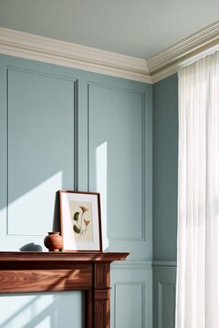 Living room corner featuring a dark walnut mantelpiece with a framed botanical print, light blue walls, and sheer white curtains allowing natural light to illuminate the space