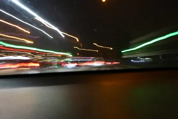 Abstract image of multicolored lights in the city. © indigolotos