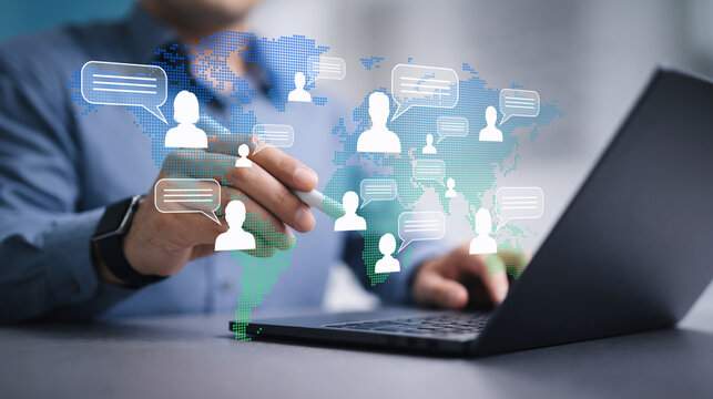 Remote team communication across global workforce network. Virtual collaboration and worldwide business communication. Businessman connecting distributed teams on laptop.