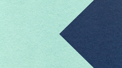 Fototapeta premium Textured light mint green paper background with dark blue arrow, macro. Template with copy space for banner, presentation