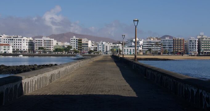 shot looking down Calle Punta de la Lagarta, with Arrecife in background