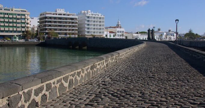 shot looking down Calle Punta de la Lagarta, with Arrecife in background