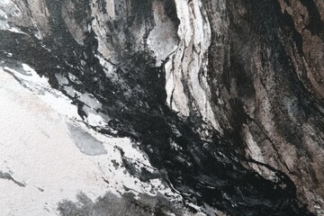 Naklejka premium Abstract ink wash showing dark swirls and shapes merging against light, textured background
