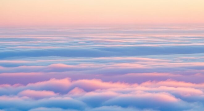 Beautiful pastel clouds at sunrise or sunset, creating a serene atmosphere.
