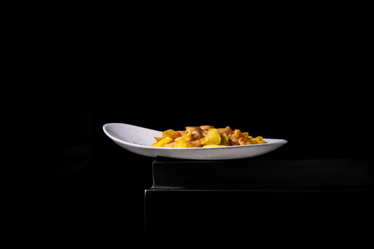 Gourmet fries appetizer with sauce on upscale restaurant dish on dark background
