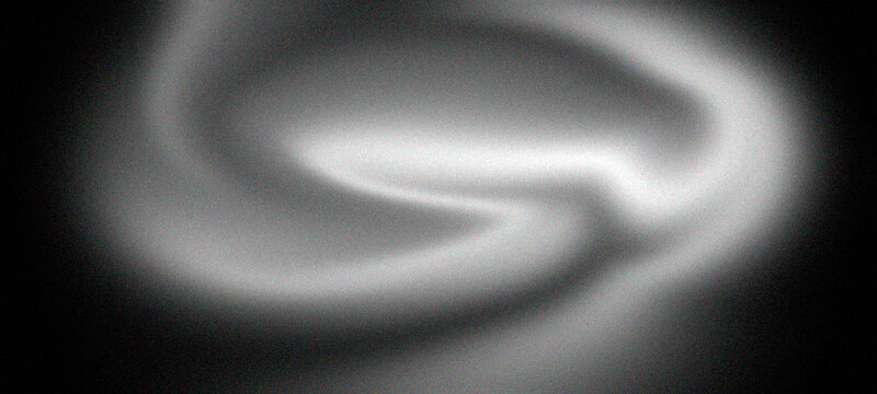 Abstract smooth white smoke shapes flowing against deep black background creating ethereal soft light curves for mysterious artistic moody atmospheric visuals in high resolution graphic design work