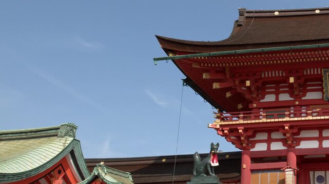 Traditional Vermilion Japanese Shrine Architecture Under Clear Blue Sky