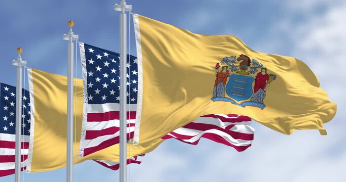 New Jersey state flags waving with the american flag on a clear day