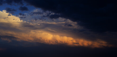 Fototapeta premium Sunset sky with orange clouds. Nature background.