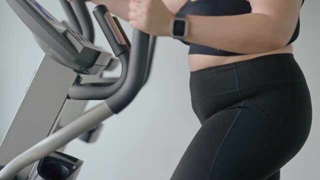 Plus Size Woman Running on Treadmill During Cardio Workout at Gym