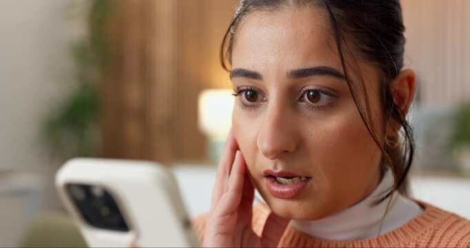 Phone, surprise and woman on sofa in home with blog on app for celebrity gossip, social media or texting. Shock, wow and female person with cellphone for online alert, notification or announcement.