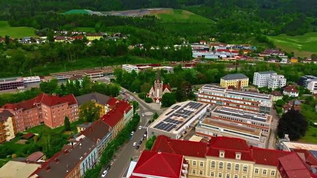 Aerial view of beautiful industrial town of Leoben in the mountains in central Austria with heavy industry and metallurgy