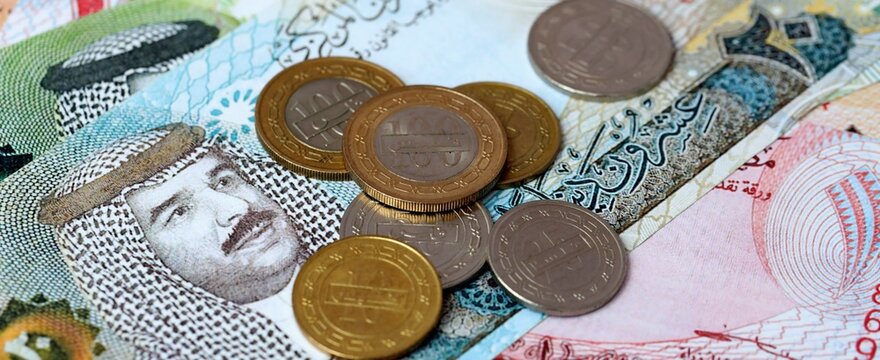 Bahraini dinar money bills and coins on table. Bahrain cash of BHD currency close up
