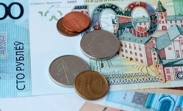 Belarusian ruble money bills and coins on table. Belarus cash of BYN currency close up