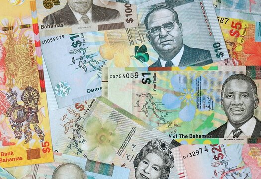 Bahamian dollar money banknotes bunch on table. Bahamas bills of BSD currency close up