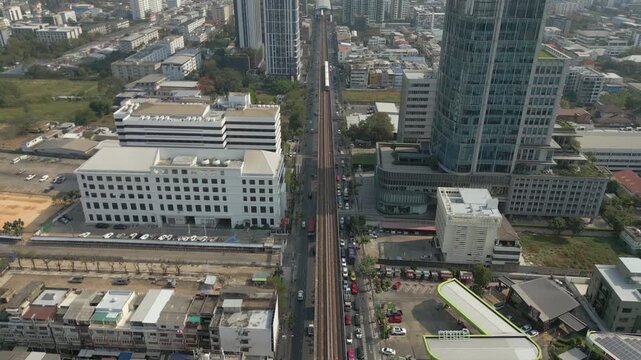 BTS Skytrain Moves Through Bang Chak Neighborhood Bangkok City Thailand Drone Birdseye 4K 60FPS