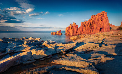 Naklejka premium Colorful evening view of Arbatax resort. Majestic summer seascape of Mediterranean sea with Red Rock. Stunning outdoor scene of Sardinia island, Italy Europe. Beauty of nature concept background.