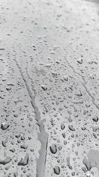 Raindrops Trickling Down a Window Pane