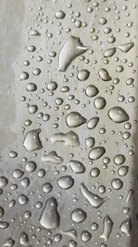 Macro Detail of Water Beads on Polished Chrome Surface
