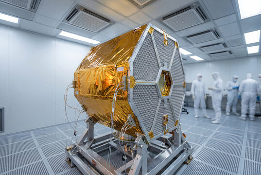 Space telescope assembly inside aerospace cleanroom facility