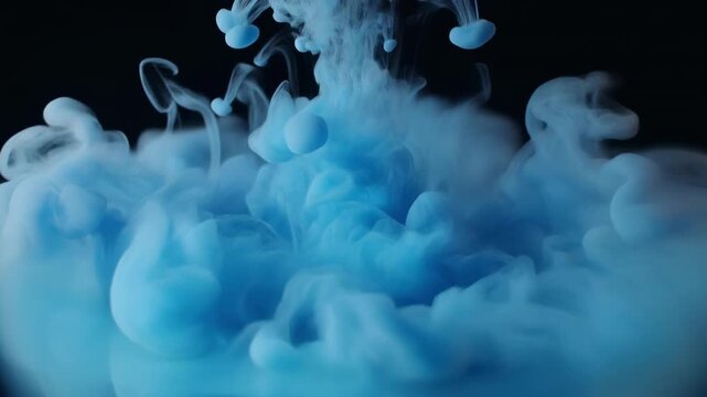 Blue ink swirling in water motion timelapse