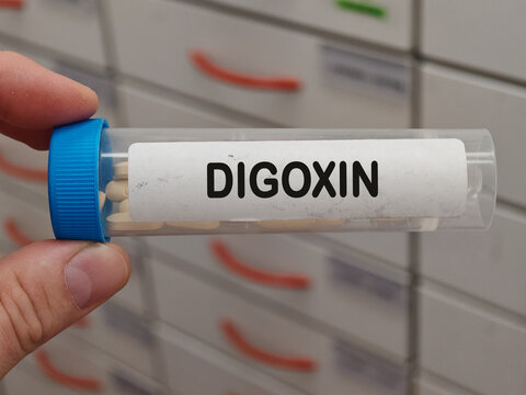 Transparent plastic Box of DIGOXIN tablets on a hospital pharmacy table used to treat heart failure and arrhythmias a cardiac glycoside.
