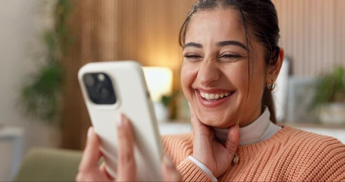 Phone, celebration and excited with woman on sofa in home for social media giveaway, winner and news. Online prize draw, success and announcement with person in living room of house for mobile bonus