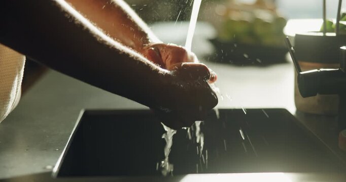 Soap, water and washing hands in home for health maintenance, germ removal or wellness. Person, kitchen tap and cleaning skin for bacteria prevention, hygiene safety and self care with disinfection