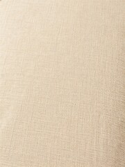 Fototapeta premium Close-up of Beige Fabric Texture with Soft Lighting
