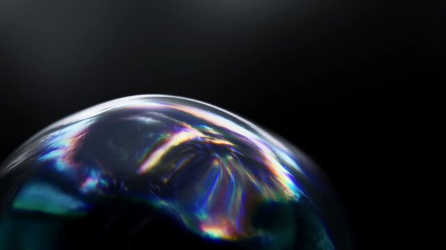 Iridescent soap bubble membrane midsequence drifting across dark background with bright highlight