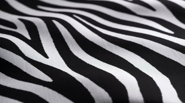 Close-up of flowing zebra-striped fabric showcasing dynamic patterns and textures. Ideal for fashion, design, and creative projects