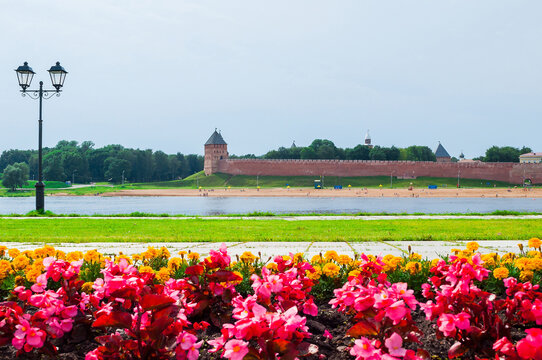Veliky Novgorod Russia. Novgorod Kremlin fortress and water area of Volkhov river in summer cloudy day - architecture landscape. Selective focus at the architecture