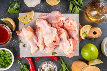 Fresh raw organic chicken wings, with spices and condiments © ricka_kinamoto