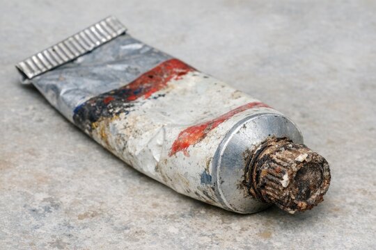 A tube of toothpaste lying on the ground